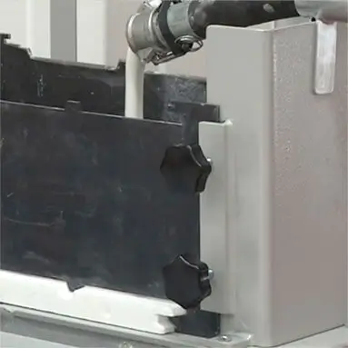 Plaster being poured into machine